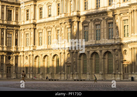 Paris Louvre backyard - Tourists walking along the Cour Caree, one of the courtyards of the Louvre Palace in France, Europe. Stock Photo