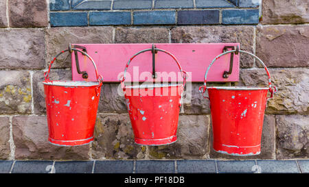 Red Metal Fire Buckets Stock Photo