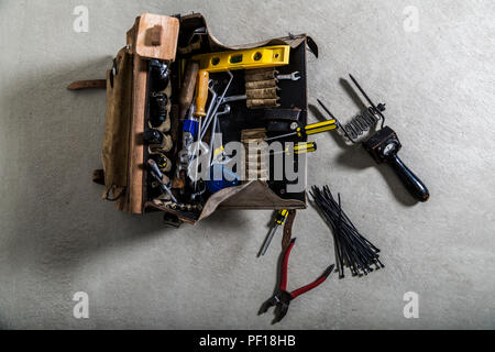 Box with electrician tools on leather background Stock Photo
