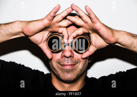 Man in steampunk glasseses on white background Stock Photo