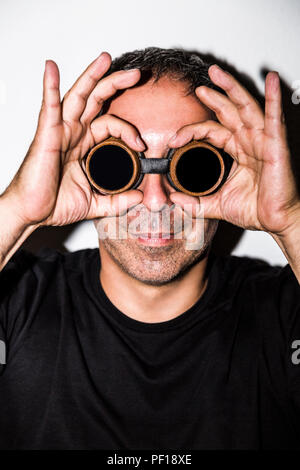 Man in steampunk glasseses on white background Stock Photo