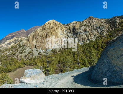 Sharp turn mountain road on the background of the rocky mountains in the Himalayas, Nepal. Stock Photo