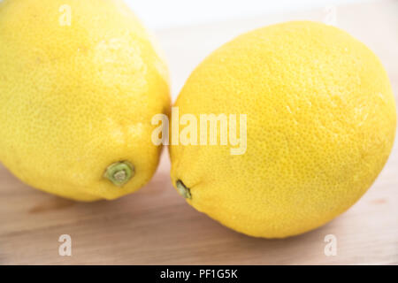 fresh lemon on the chopping block, isolate background Stock Photo