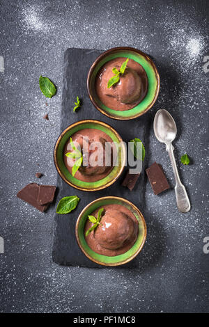 Chocolate ice cream top view on black. Stock Photo