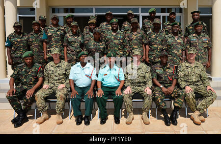 Members of the Tanzania People's Defence Force and Combined Joint Task Force-Horn of Africa's Explosive Ordnance Disposal Mobile Unit 1 pose for a photo after a graduation Feb. 17, 2016. The ceremony marked the conclusion of the 25-day Humanitarian Mine Action Level 1 training in Dar es Salaam, Tanzania. The training was the first phase in a curriculum designed to build  a cadre of HMA/Counter-Improvised Explosive Device trainers within the TPDF. (U.S. Air Force photo by Tech. Sgt. Dan DeCook) Stock Photo