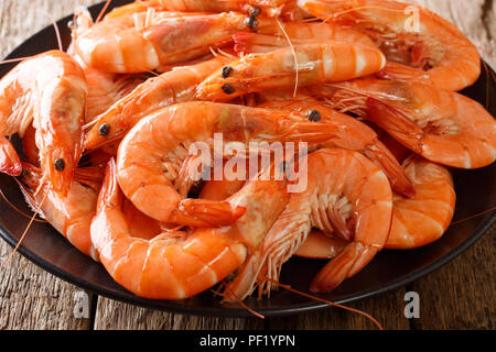 dish with boiled king prawns close-up on a plate. Food background. horizontal Stock Photo