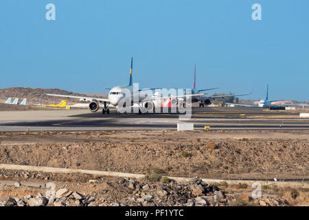 Tenerife, Spain - August 26, 2016: Airplanes waiting for take off in Tenerife south airport, Canary islands, Spain. Stock Photo