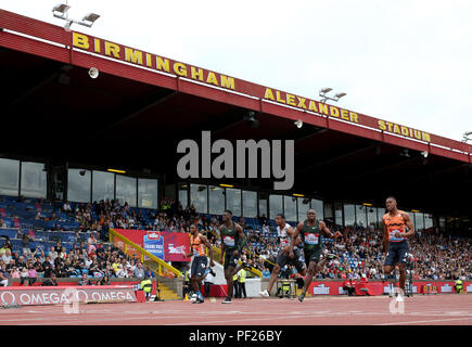 Great Britain's Reece Prescod (second left) finishes second, USA's Christian Coleman (centre) wins and USA's Noah Lyles (left) finishes third in the Men's 100m Final during the Muller Grand Prix at Alexander Stadium, Birmingham. Stock Photo