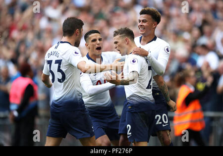 Tottenham Hotspur's Kieran Trippier (centre) celebrates scoring his side's second goal of the game with team-mates during the Premier League match at Wembley Stadium, London. Stock Photo