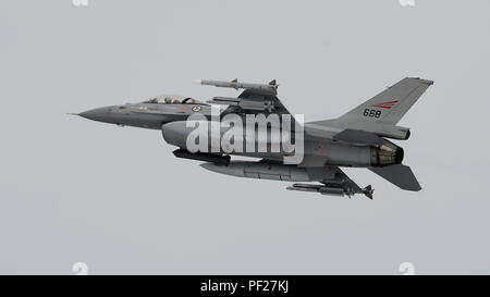 On February 29, 2016, a Norwegian Air Force F-16 Fighting Falcon took off from Bodø Main Air Station, Norway, during Exercise Cold Response 16. The exercise involved NATO allies demonstrating interoperability, rapid deployment, and defense readiness in cold-weather environments. Aircraft operations included precision takeoffs, tactical maneuvers, and coordination with Belgian and Italian air forces. Cold Response exercises strengthen multinational defense capabilities and test Arctic operational proficiency under extreme winter conditions. Stock Photo