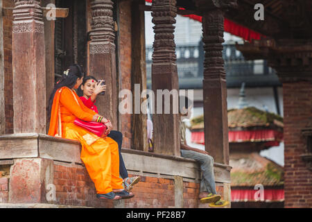 kathmandu,Nepal - Aug 11,2018: A Girl taking selfie at the temple of Kathmandu Durbar Square,Kathmandu. Stock Photo