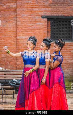 Kathmandu,Nepal - Aug 11,2018: Nepali Dancers taking selfie with friends in basantapur,kathmandu. Stock Photo