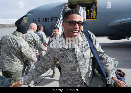 Senior Airman Chaz Payton, 434th Maintenance Squadron integrated instrument specialist, smiles after shaking hands with 434th Air Refueling Wing leadership and seeing his family, after returning to Grissom Air Reserve Base from a deployment to Southwest Asia Feb. 7, 2016. A total of 68 Airmen returned from a 4-month deployment in support of Operation Inherent Resolve. (U.S. Air Force photo/Tech. Sgt. Benjamin Mota) Stock Photo