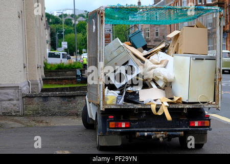 Washing machine and fridge on lorry for recycling waste site Stock Photo