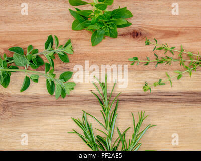 Wooden board with fresh herbs. top down view Stock Photo