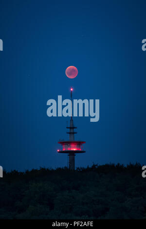 Blood moon red shining right above broadcasting tower germany Stock Photo