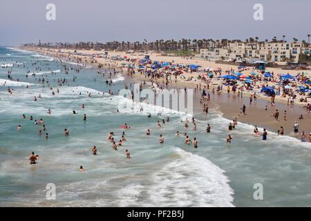 crowded beach during a heat wave in Huntington Beach California Stock Photo