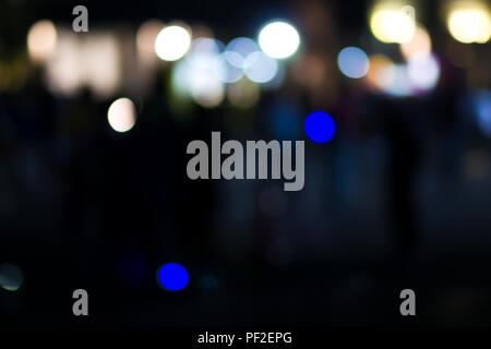Abstract city street light defocused at night, blur bokeh, colorful & dark background. Stock Photo