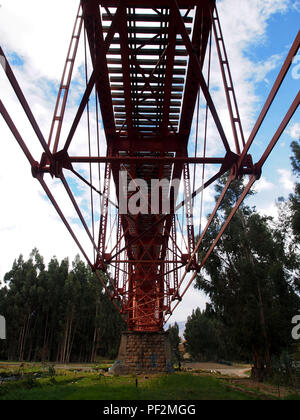 View from below the railway of the historic 'Tren Macho' (Macho Train) at the Huancan bridge, outskirts of Huancayo city. This railroad that still covers the Huancayo - Huancavelica route in Peru, at some point was so important that its travel tickets were used as cash in the region. Stock Photo