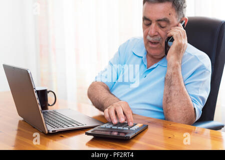 Man doing his accounting, financial adviser. Stock Photo