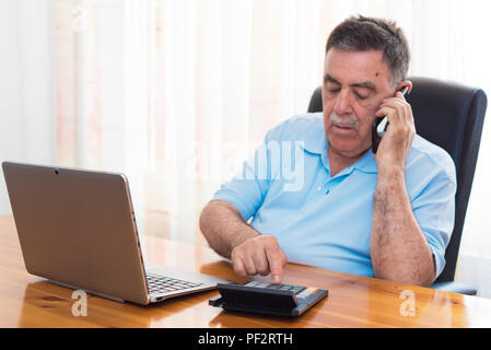 Man doing his accounting, financial adviser. Stock Photo