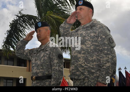 Brig. Gen. Stephen Curda, (left), Commander, 9th MSC, and Command Sgt. Maj. Christopher Lindung, salute the formation at conclusion of the 9th MSC’s change of responsibility ceremony at the U.S. Army Reserve Daniel K. Inouye complex.(U.S. Army photo by Capt. Debbie Eddin) Stock Photo