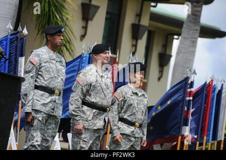 From left, Gen. Vincent K. Brooks, Commander, USARPAC ; Brig. Gen. John Cardwell, outgoing commander, 9th MSC; and Brig. Gen. Stephen Curda, incoming commander of the 9th MSC, stand at attention during the change of command ceremony at the Daniel K. Inouye Complex, Aug. 29 Stock Photo