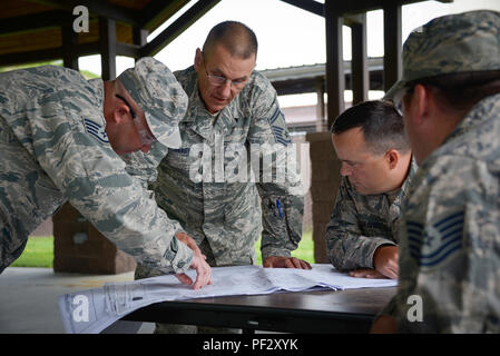 134th Air Refueling Wing is an Air National Guard unit based in Tennessee responsible for aerial refueling operations and support missions. The archival image documents Civil Engineer Squadron personnel studying construction blueprints at Joint Base Elmendorf-Richardson, Alaska on July 25, 2017, preparing for infrastructure and electrical work during training. Stock Photo
