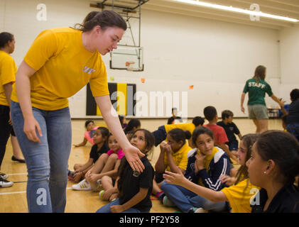 170919-N-KB426-292  OKLAHOMA CITY (Sept. 19, 2017) Seaman Sydney Donovan, assigned to the USS Constitution, left, interacts with students at the Santa Fe South Boys and Girls Club during a community relations event as part of Navy Week Oklahoma City. Navy Week programs serve as the principal outreach effort into areas of the country without a significant Navy presence, helping Americans understand that their Navy is deployed around the world, around the clock, ready to defend America at all times. (U.S. Navy photo by Mass Communication Specialist 2nd Class James Vazquez/Released) Stock Photo