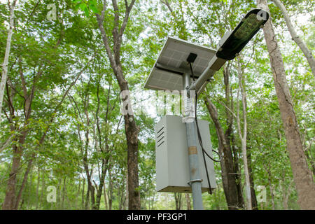 outdoor lighting pole, street light led pole with small solar cell panel in public park Stock Photo