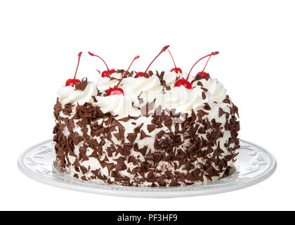 black forest cake on an off white plate isolated on a white background. Whipped cream, shaved chocolate candy, cherries on top. Stock Photo