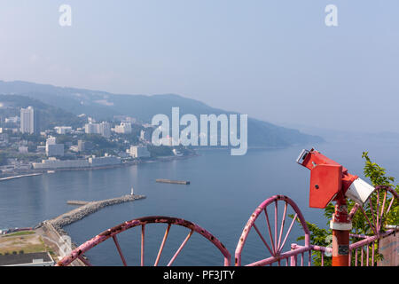 Coin-operated binoculars at vantage point overlooking the coast of Atami, Shizuoka Prefecture, Japan Stock Photo