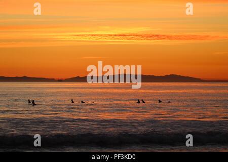 Sunset surfing in Huntington Beach California Stock Photo