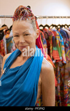 https://l450v.alamy.com/450v/pf3pk2/an-attractive-woman-in-her-sixties-with-youthfully-styled-hair-in-a-retail-store-in-greenwich-village-manhattan-new-york-city-pf3pk2.jpg
