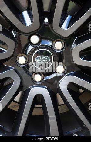 Range Rover Autobiography in Spectral Racing Red - ChromaFlair seen parked in old stone slab floored courtyard. Property released Stock Photo