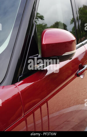 Range Rover Autobiography in Spectral Racing Red - ChromaFlair seen parked in old stone slab floored courtyard. Property released Stock Photo