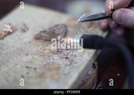 Industrial manufacture of the gold ring.Making a Gold Product Stock Photo