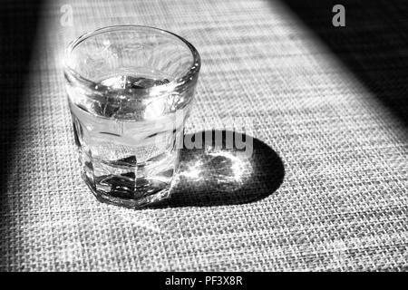 Black and white small glass of liquor, grappa glass Stock Photo
