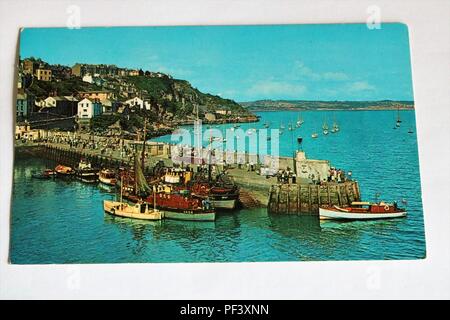 1960s 1970s colour photo postcard of The Pier, Brixham, Devon, UK - Social History Stock Photo