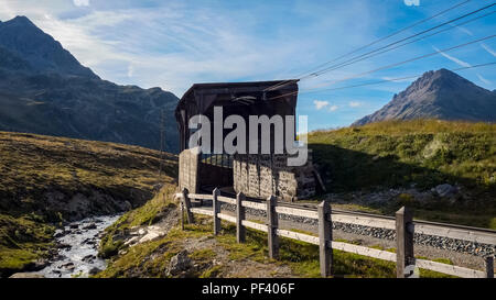 Train tunnel on top of The Bernina Pass (Italian: Passo del Bernina), a mountain pass in the Bernina Range of the Alps, in the canton of Graubunden Stock Photo