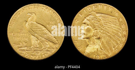 gold eagle two and a half dollar 1913 US coin with indian head isolated on black background Stock Photo