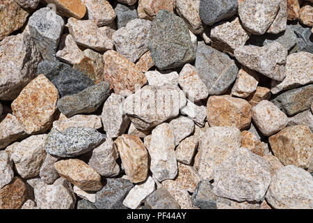 worn mixed igneous cobble rock background texture Stock Photo