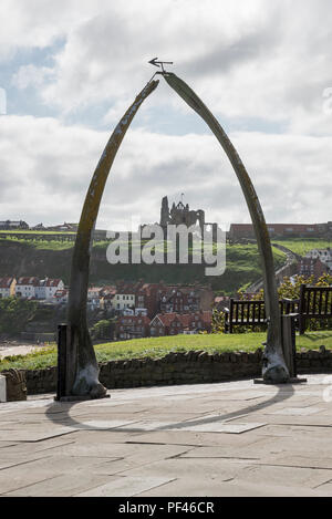 The famous Whale Bone Arch at Whitby, framing a view of St Mary's Church and the Abbey. North Yorkshire, England. Stock Photo