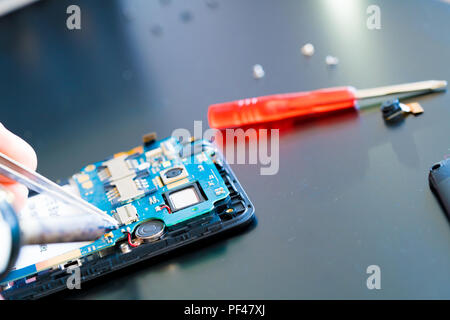 Fix and repair cell phone PCB Stock Photo