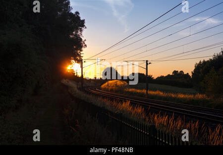 Sunset on the Network Rail west coast main railway line at Yanwath, Penrith, Cumbria, UK Stock Photo