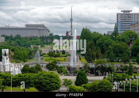 The view to Mensu Hill across Mansudae Fountain Park and statue of the Dance of Snow Falls' in Pyongyang, North korea Stock Photo