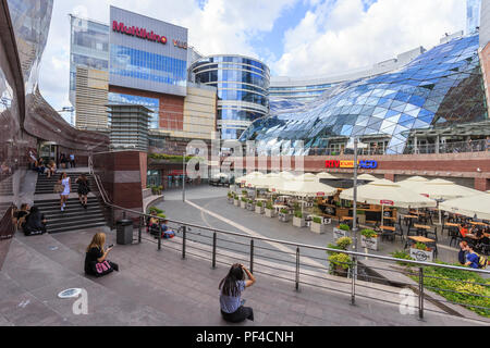 Zlote Tarasy (Golden Terraces) is a commercial, office, & entertainment complex in center of Warsaw, Poland, located next to  Central Railway Statio Stock Photo