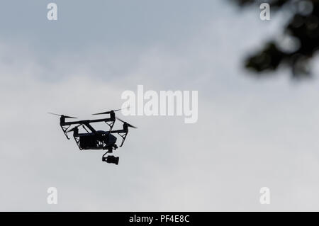 Flying drone with a camera Stock Photo