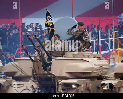 Peruvian soldiers saludating on board of the ZSU-23-4 'Shilka', a lightly armored Soviet self-propelled, radar guided anti-aircraft weapon system (SPAAG) at  the traditional military parade for the 197th anniversary of Peruvian Independence Day Stock Photo