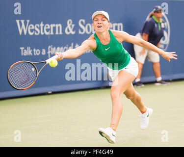 Ohio, USA. 18 August 2018.  Simona Halep (ROU) hits the ball back to Aryna Sabalenka (BLR) at the Western Southern Open in Mason, Ohio, USA. Brent Clark/Alamy Live News Stock Photo